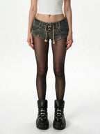 Distressed washed denim micro shorts with a lace up front