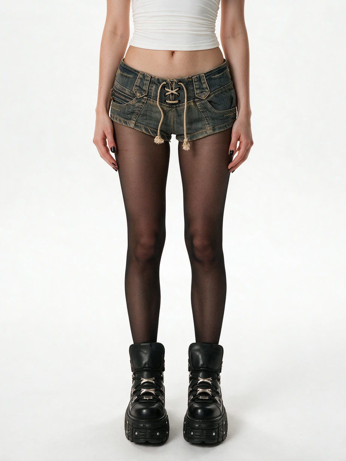 Distressed washed denim micro shorts with a lace up front