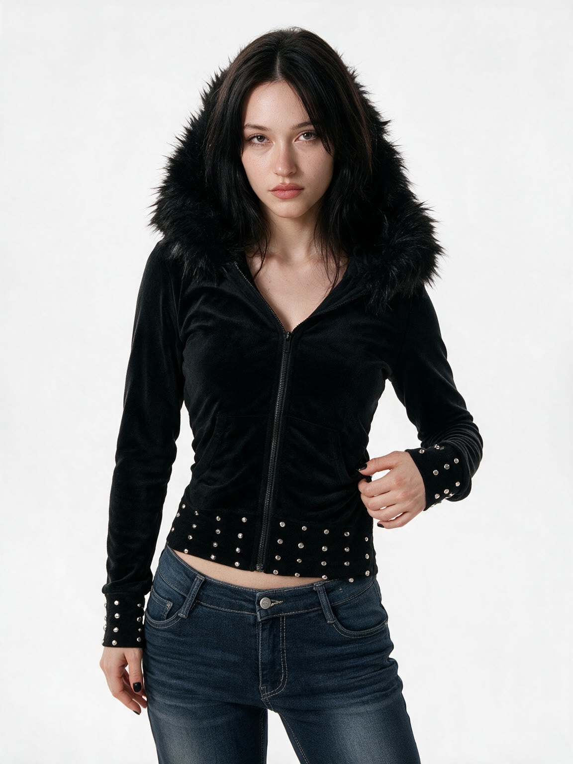 Slim black jacket with a faux fur hood and studded hem