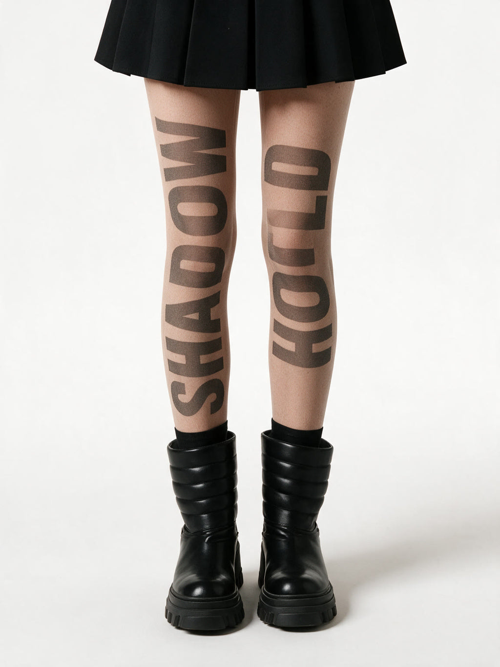 Sheer nude tights with slogan lettering printed down the leg