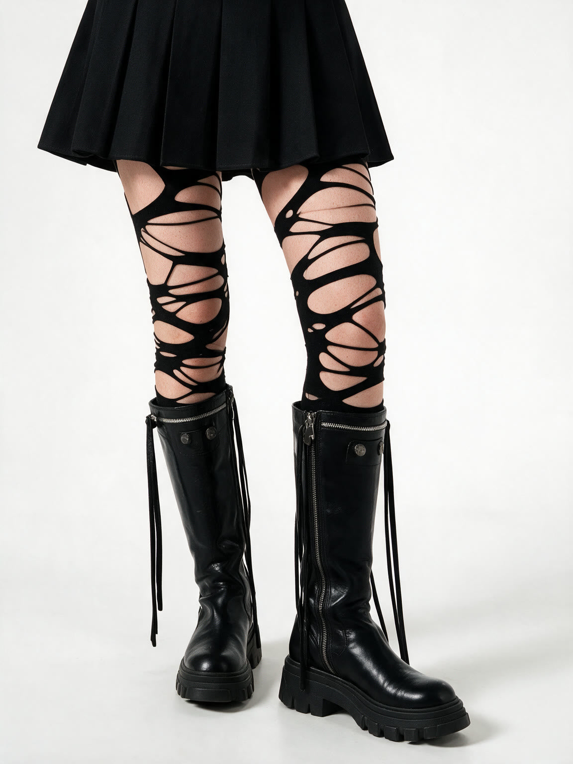 Black tights torn into ladders up both legs