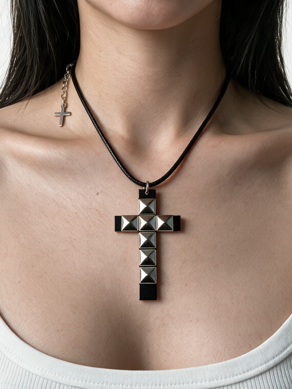 Black studded cross pendant on a cord necklace