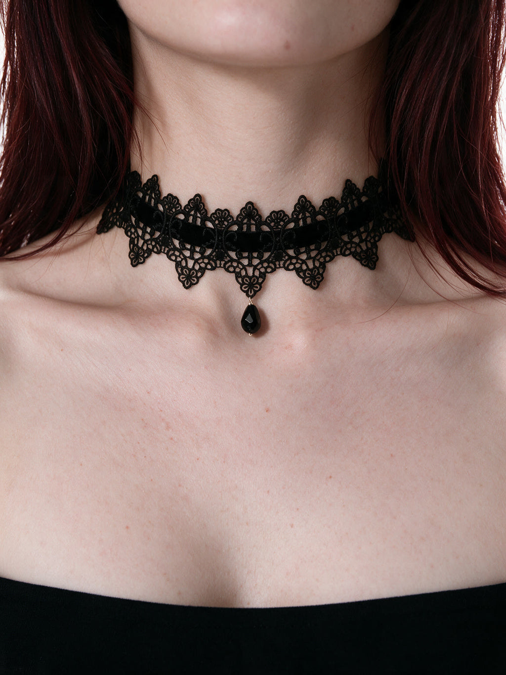 Black lace choker with a teardrop pendant and ribbon ties