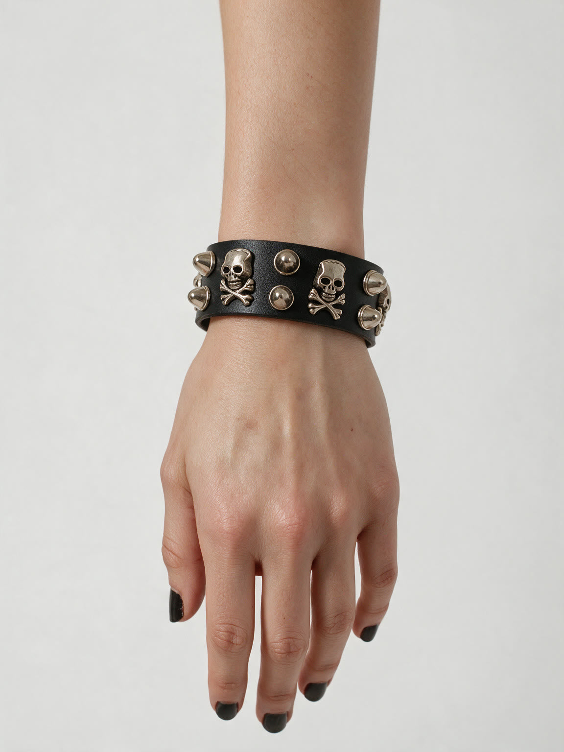 Black leather cuff bracelet with silver skull studs