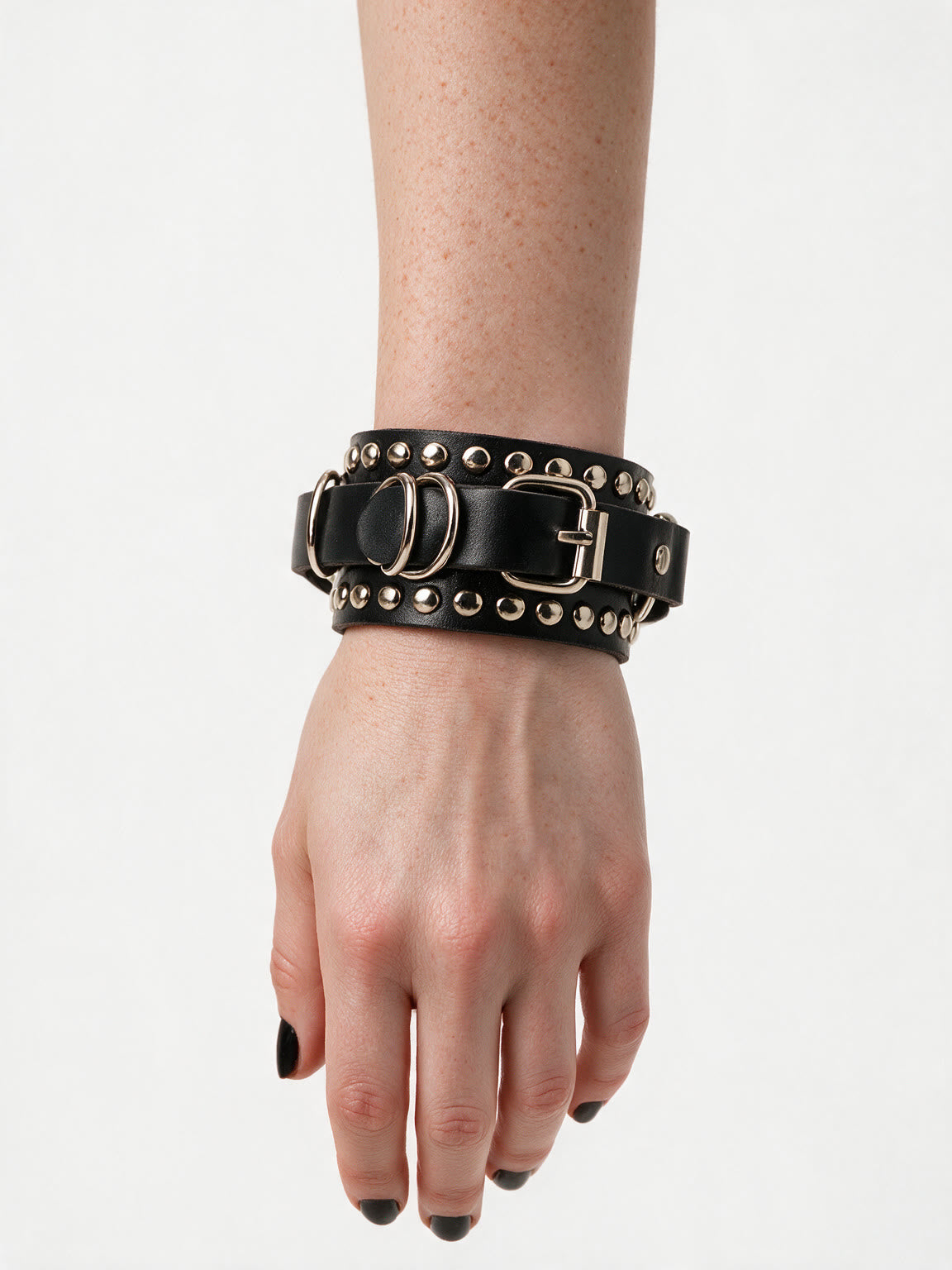 Black studded leather cuff bracelet with a buckle