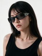 Small square black sunglasses with engraved silver temples