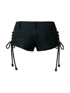 Black denim shorts with side lacing and skull studs