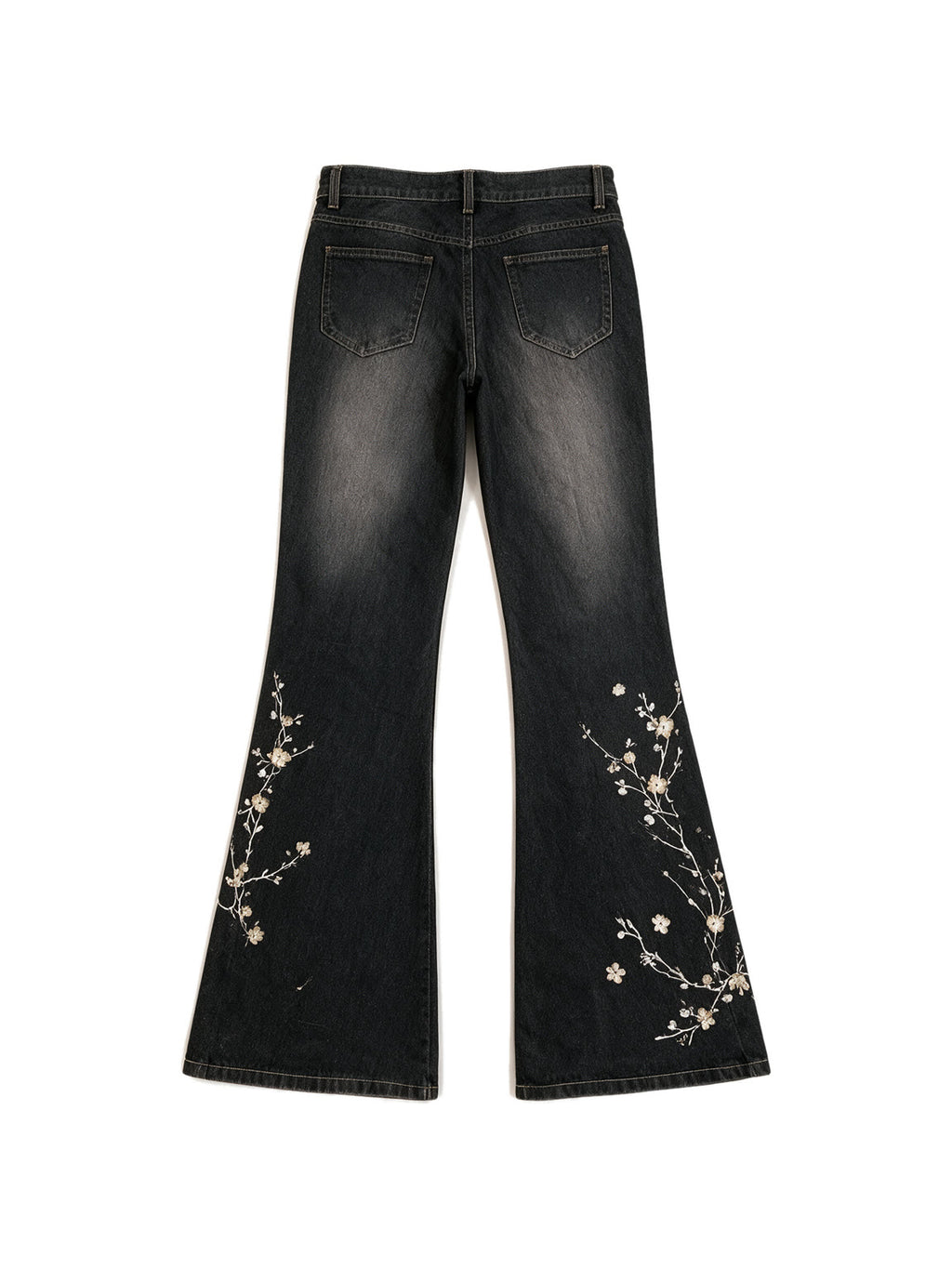 Washed black flare jeans with pale floral embroidery