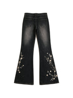 Washed black flare jeans with pale floral embroidery