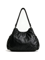 Black studded hobo bag with braided handles and tassel zips