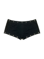 Black micro shorts with grommets and a gold cross