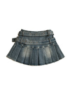 Washed denim pleated mini skirt with a riveted belt