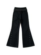 Black cargo flare trousers with rivets and a studded belt