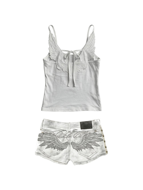 White cami with embroidered angel wings and studded white denim shorts