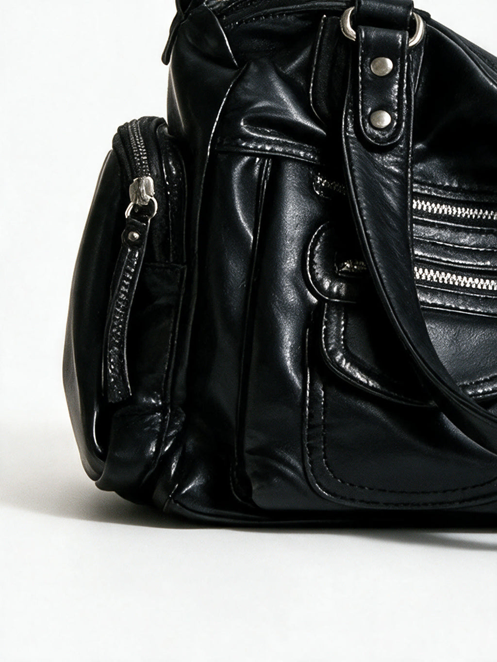 Black leather shoulder bag with multiple cargo pockets