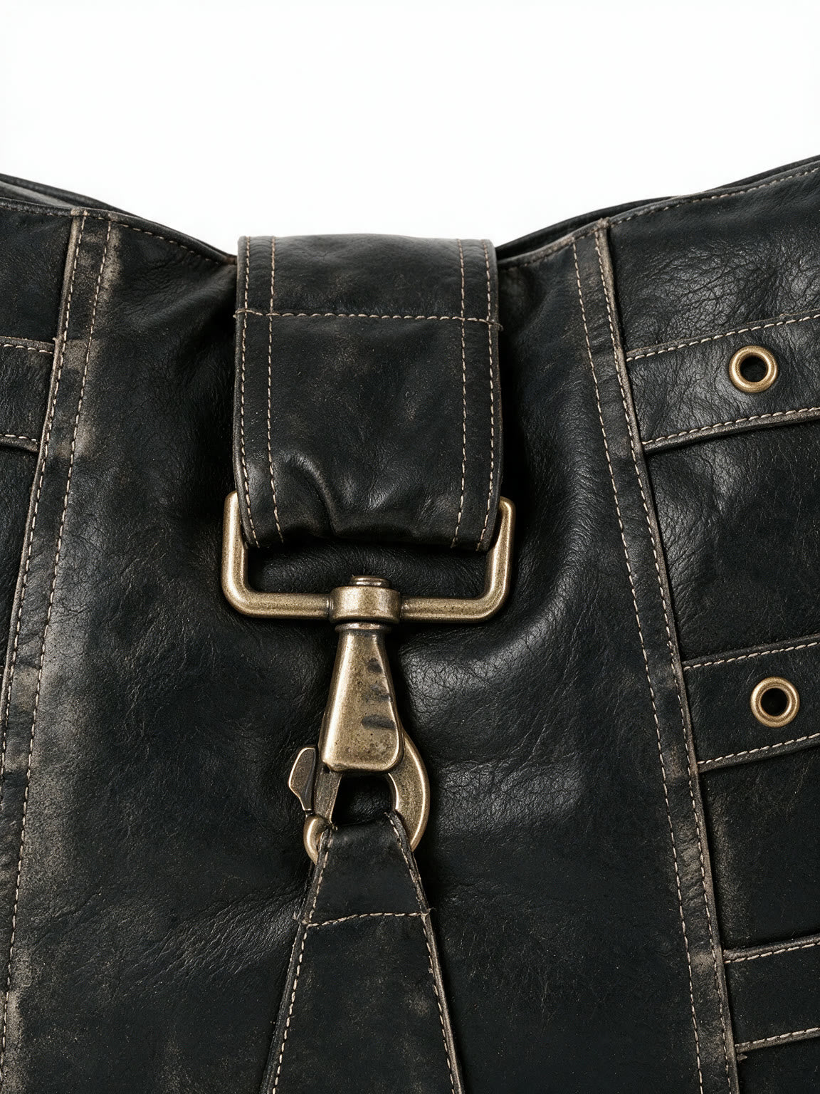 Black leather shoulder bag with multiple buckled straps and a padlock charm