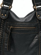 Washed black leather zip tote with braided trim