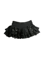 Black ruffle mini skirt with lace trim and satin bows