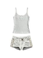 White cami with embroidered angel wings and studded white denim shorts