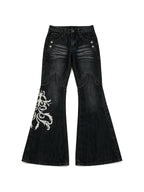 Black flare jeans with white filigree embroidery