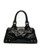 Black leather baguette bag with a large silver star and studs