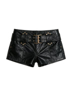 Black faux leather low rise shorts with a buckle belt