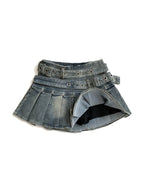 Washed denim pleated mini skirt with a riveted belt