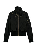 Cropped black bomber jacket with a studded buckled collar