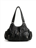 Black studded hobo bag with braided handles and tassel zips