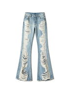 Light wash destroyed flare jeans with shredded legs
