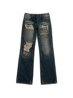 Distressed dark blue jeans with rivet patches