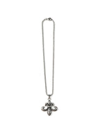 Ornate silver baroque cross pendant on a long chain