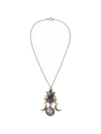 Silver crescent moon necklace with a purple amethyst stone