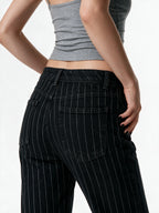 Black pinstripe low rise bootcut trousers