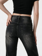 Washed black flare jeans with an asymmetric waistband