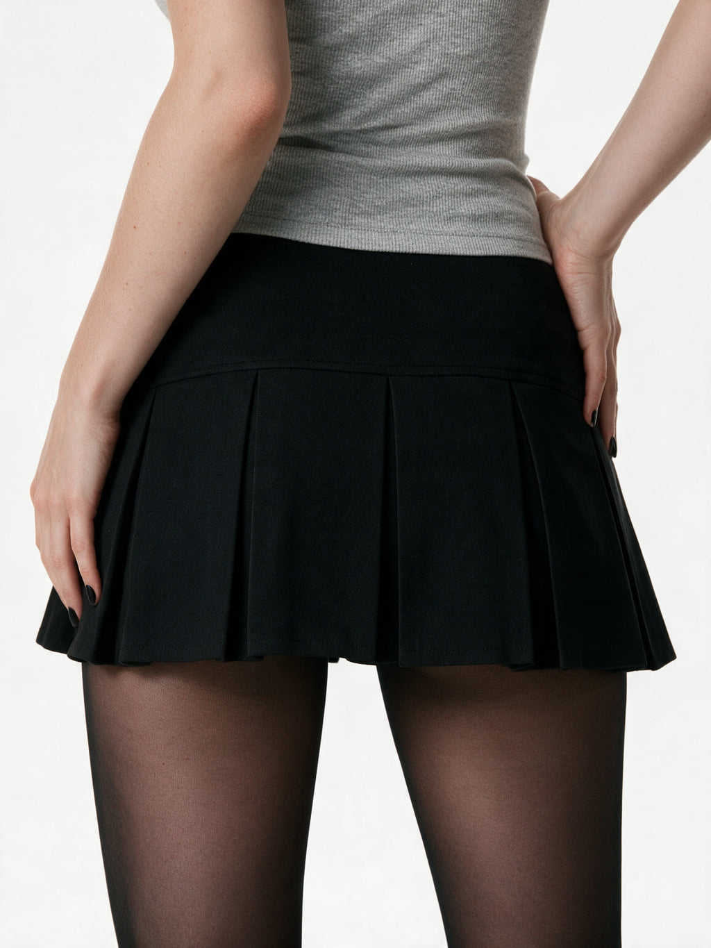 Black pleated mini skirt with silver side buttons