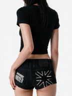 Washed black denim micro shorts with exposed zips