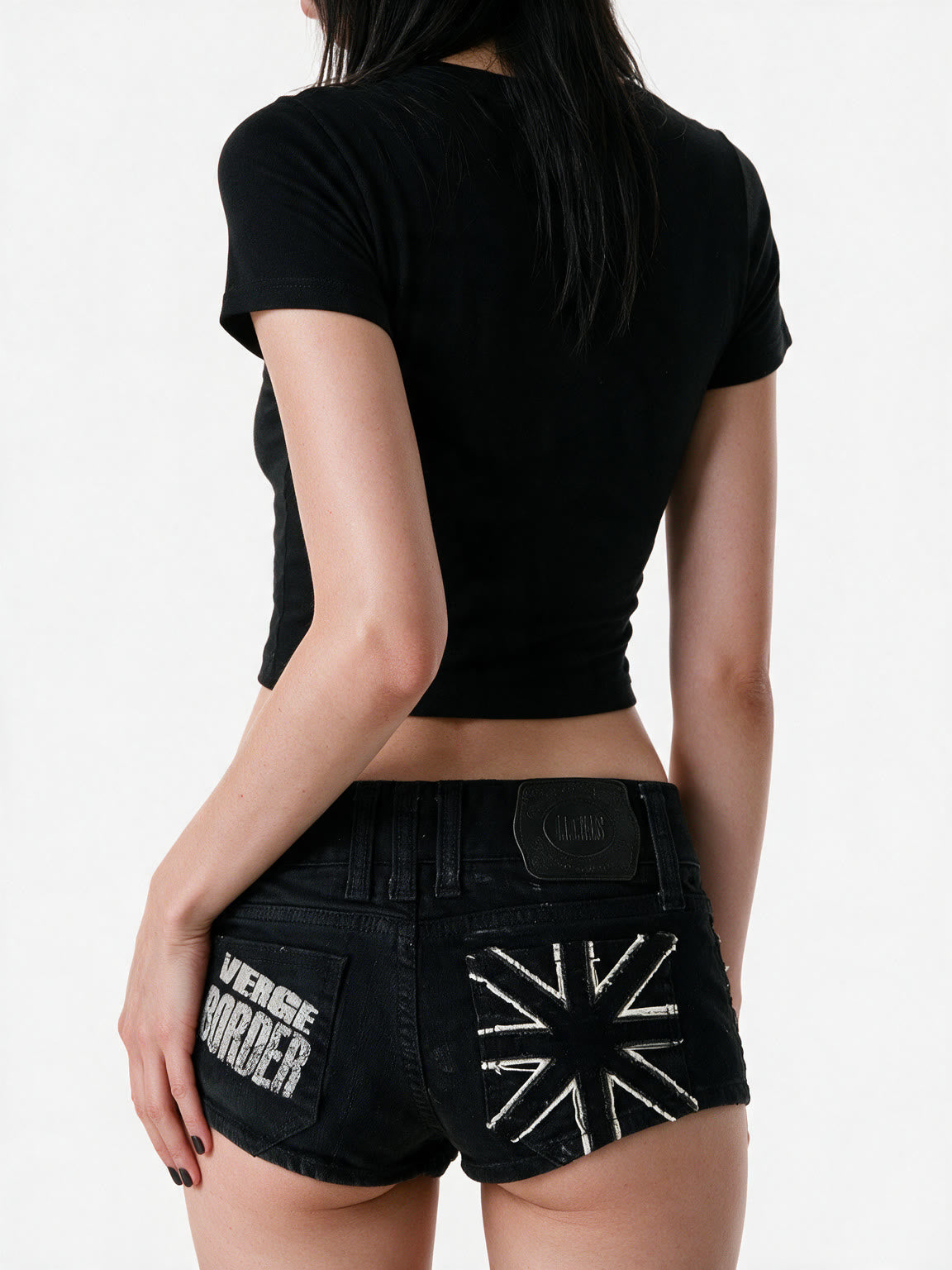 Washed black denim micro shorts with exposed zips