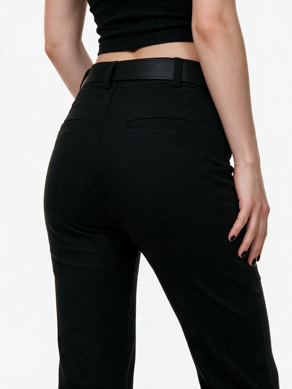 Black high waist flare trousers with a studded belt